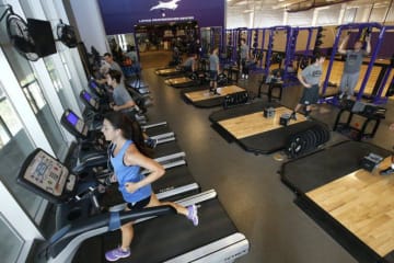 exercise science degree students working with clients in gym