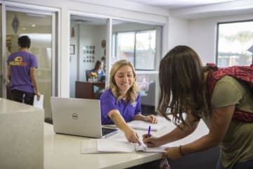 College students consulting about funds