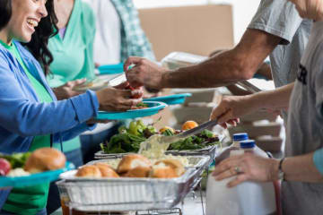 A soup kitchen serving people food