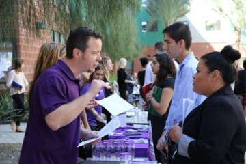 people talking at a job fair