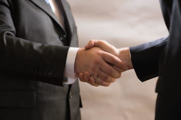 Two diplomats shaking hands