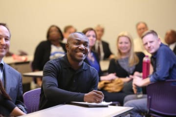 Adult students at college of doctoral studies orientation