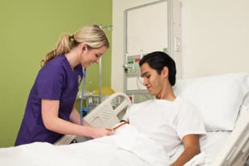 Nurse helping patient 