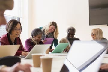 Employees collaborating during a meeting