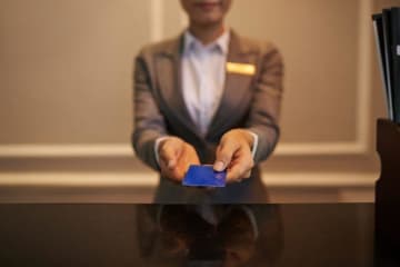 resort manager taking payment from guest