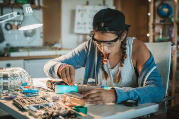 A STEM student working at her desk