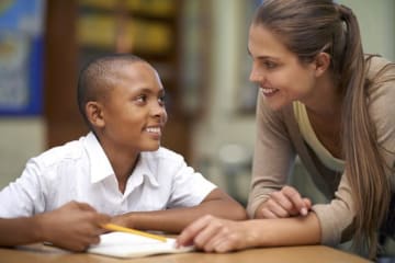 teacher helping student