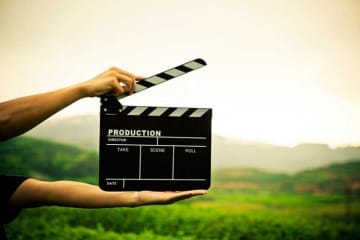 person holding clapperboard