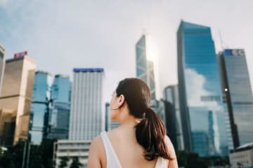 Girl looking at skyscrapers