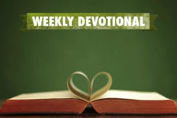 Weekly devotional text above open book with inner pages curled as a heart