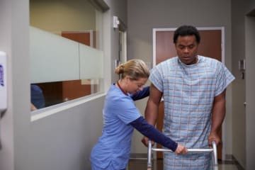 a registered nurse helping her patient