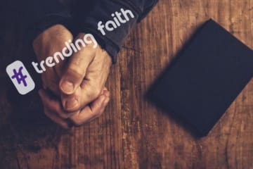 Praying hands with the trending faith logo