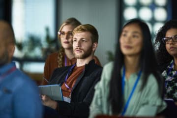 Attentive audience seated during a presentation