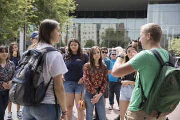 A group of students touring campus