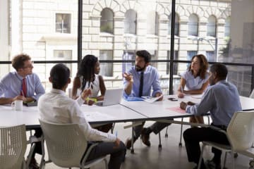 Students around table with big windows