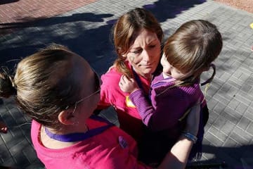 Two females with a little child