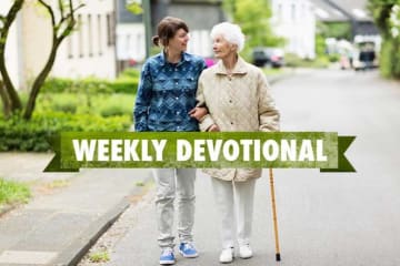 Young man helps elderly female go for a walk with weekly devotional text layered on top of image