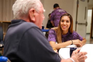 woman talking with an older man