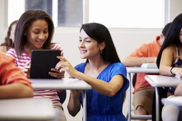 a teacher helping a student