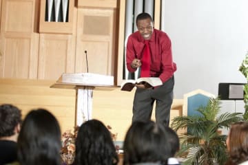 A pastor conducting a service at a church