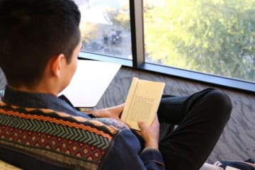 student reading a book