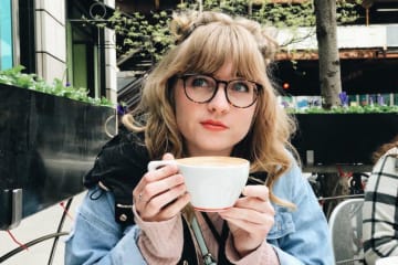 Jessalyn Johnson drinking a cup of coffee