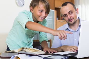 teacher helping gifted student