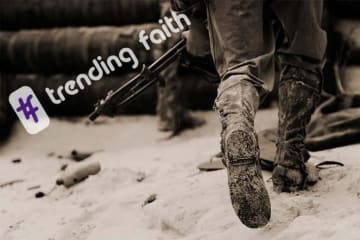 Hashtag trending faith text on top of close-up view of combat boots of two infantrymen