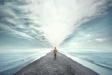 person walking on beach