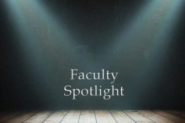 Faculty spotlight text center stage with spotlights on the text