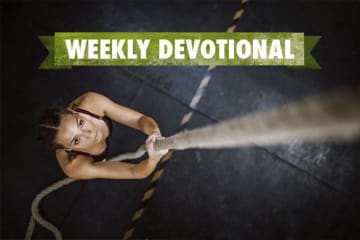 Weekly Devotional: Woman climbing up a rope