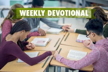 students praying in a group