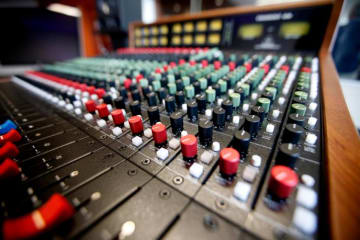 closeup of a recording studio sound board