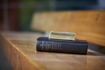 bible resting on a bench