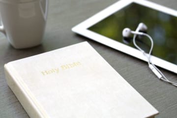 bible and i pad sitting on a table