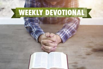 Man praying with Bible