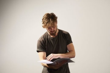 Guy reading script