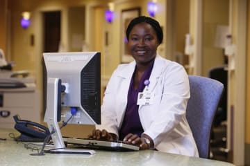 Clinical Admin works at computer station