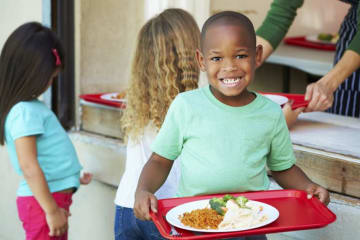 student eating a school lunch