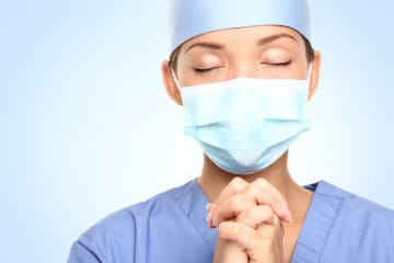 Nursing student prays close up