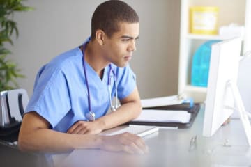 nurse working at a computer