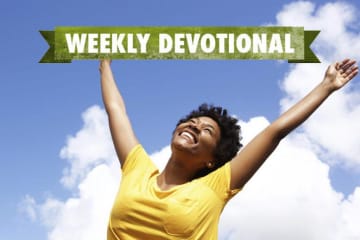 Weekly Devotional: Woman smiling with her arms up