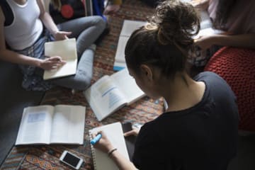 Woman studing with open books