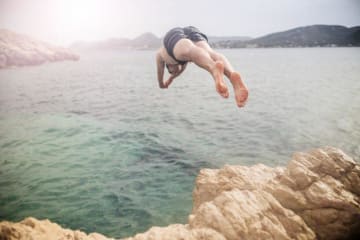 Man diving into a lake