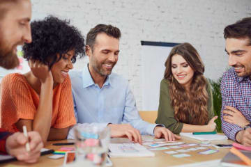 Group of professionals talking and smiling