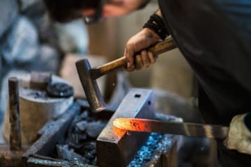 A blacksmith working with metal