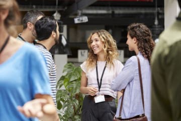 a group of MBA students networking outside of class