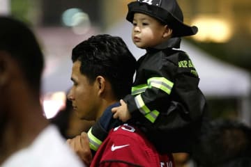 Father with little child on his back