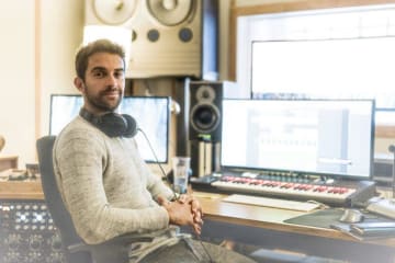 DJ sitting at a desk