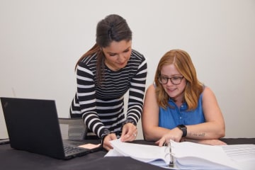 Political campaign workers collaborating on a project